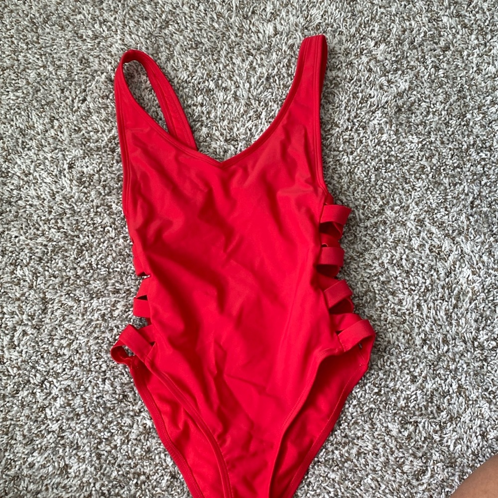Red one piece, bathing suit crisscross straps on the side circle hole open back